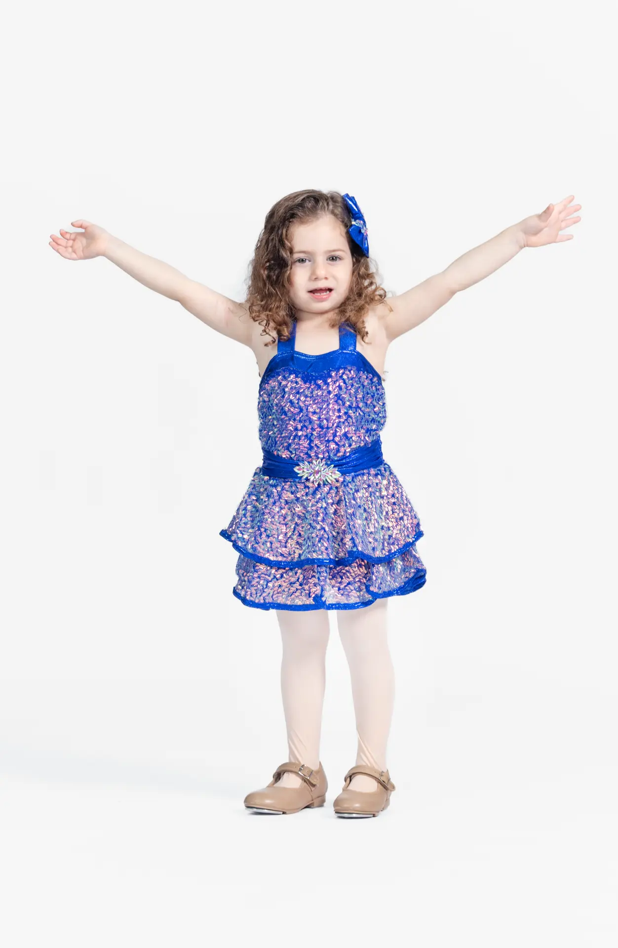 Young dancer in a blue sparkly dress