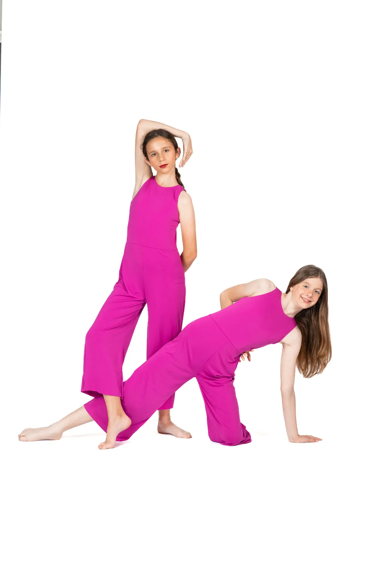 Two jazz dancers in pink jumpsuits