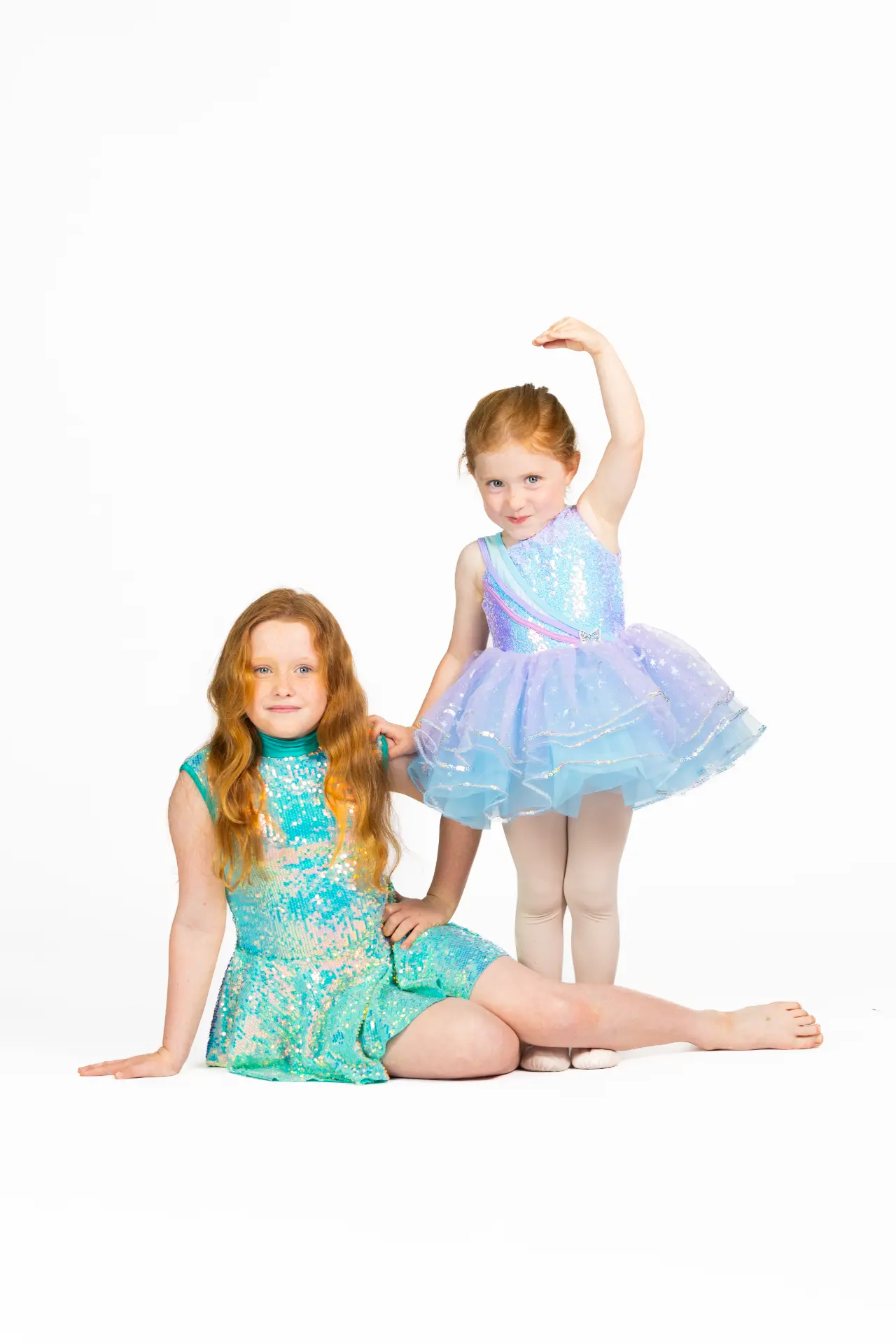 Two young dancers in sequin costumes